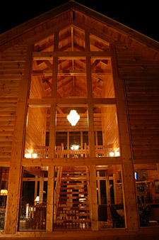 Majestic Memories log cabin at night